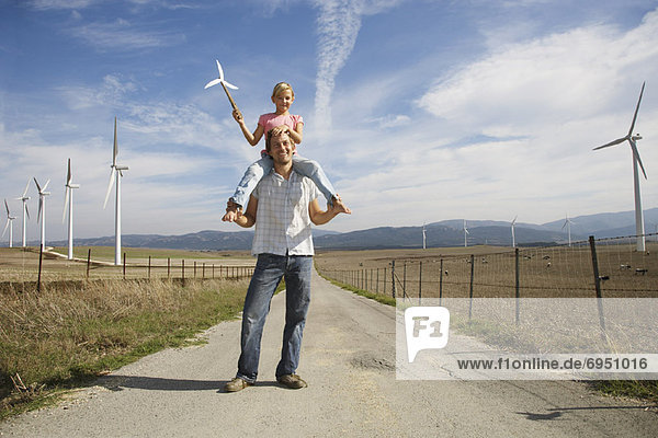 Father and Daughter with Wind Turbines