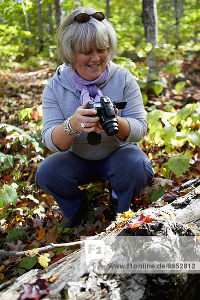Woman Filming in Forest