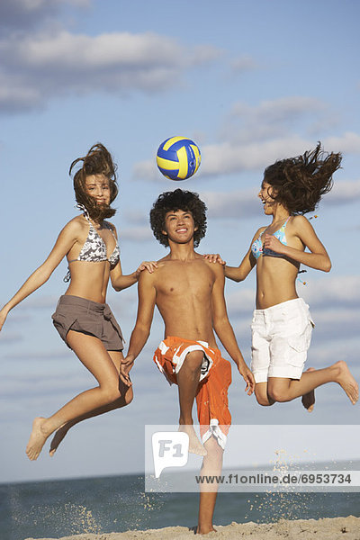 Friends with Volleyball on Beach