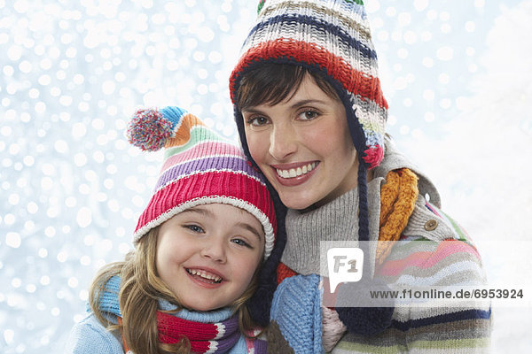 Portrait of Mother and Daughter Wearing Winter Clothing