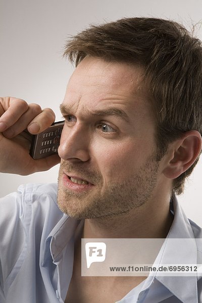 Angry Man Talking on Cell Phone