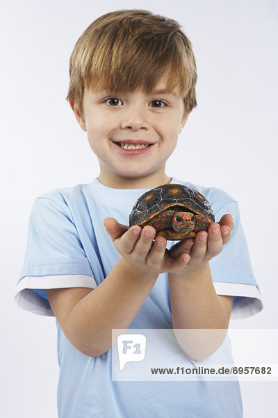 Child Holding Turtle