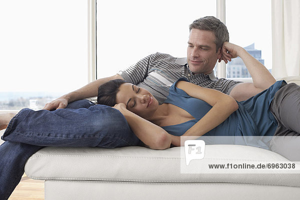 Couple on Sofa in Condominium