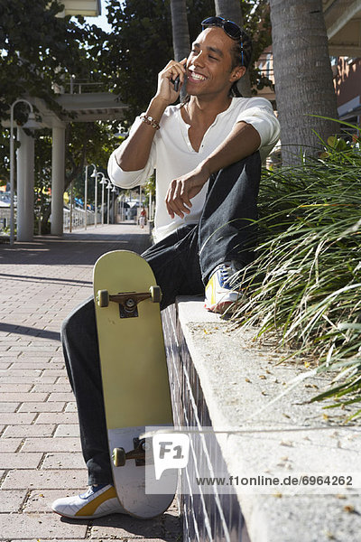 Young Man Talking on Cell Phone