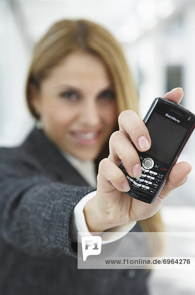 Businesswoman Holding Cell Phone