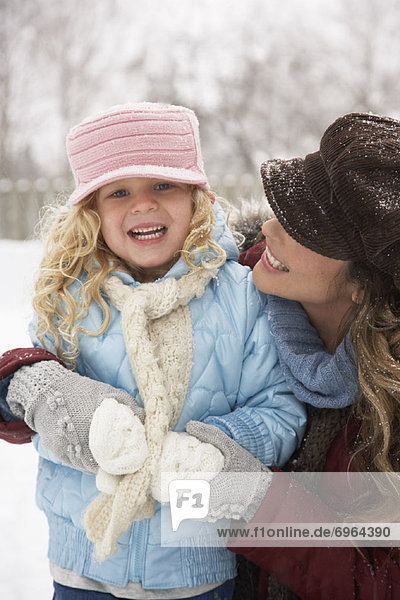 Mother and Daughter Outdoors in Winter