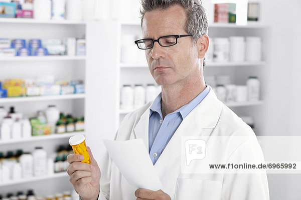 Pharmacist Reading Prescription