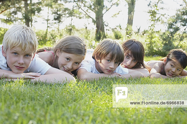 Group Portrait of Kids Lying Down Outdoors Elmvale Ontario Canada