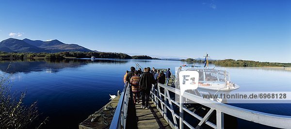 High Angle View Of Tourists On The Pier Entering The Boat In The Lake  Lakes Of Killarney  Killarney  Republic Of Ireland