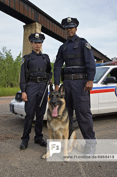 Portrait of Police Officers With Police Dog