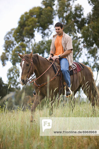 Man Horseback Riding on Ranch  Santa Cruz  California  USA