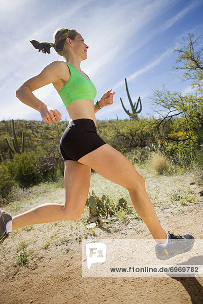 Woman Running on Desert Trail  Saguaro National Park  Tucson  Arizona  USA