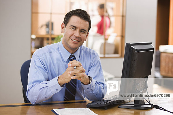 Portrait of Businessman at His Desk
