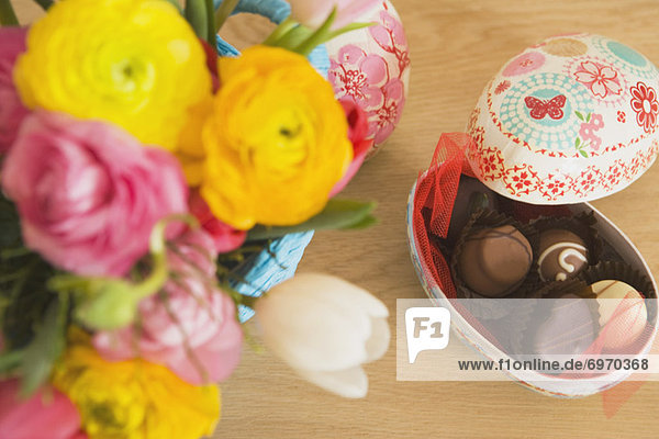 Easter Egg Filled With Chocolates  and Vase of Flowers