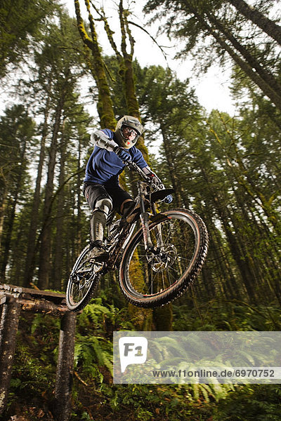 Mountain Biker Performing a Stunt  Blackrock Mountain Bike Park  Near Salem  Oregon  USA