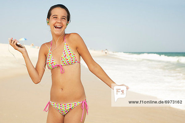 Girl on Beach With Mp3 Player