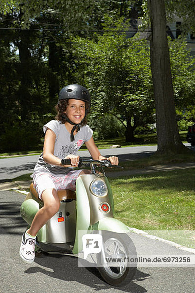 Girl Riding Scooter