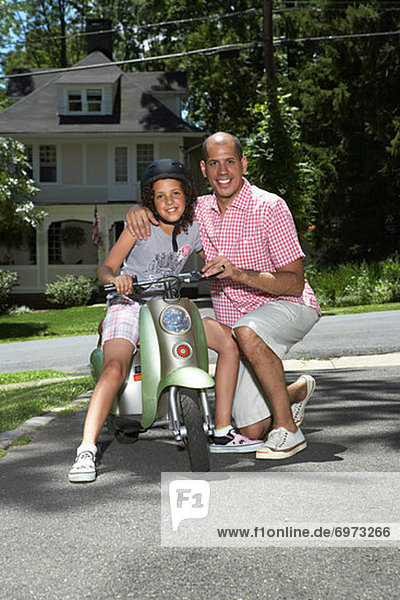 Portrait of Father and Daughter with Scooter
