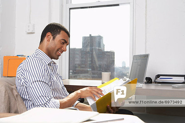 Businessman Looking at File
