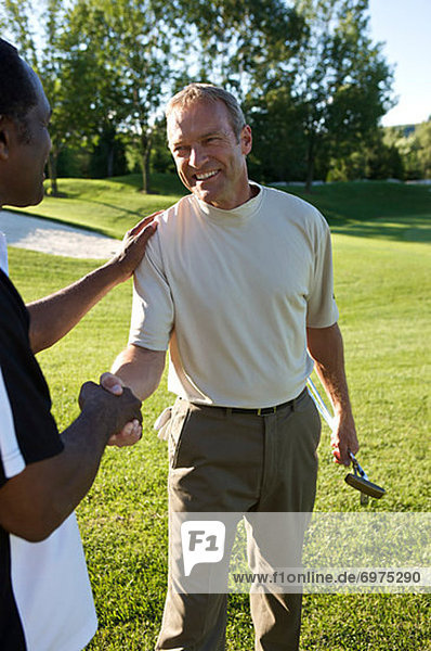 Friends Shaking Hands on Golf Course  Burlington  Ontario  Canada