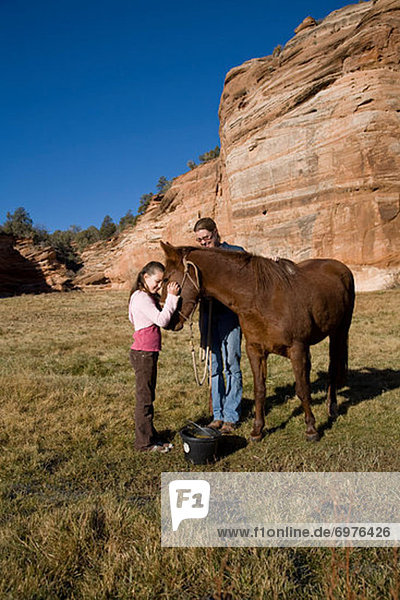 Girl Feeding Horse at Best Friends Animal Sanctuary  Kanab  Utah  USA