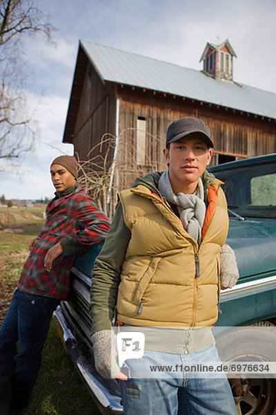 Two Young Men by an Old Pickup Truck on a Farm in Hillsboro  Oregon  USA
