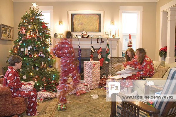 Family Opening Presents on Christmas Morning