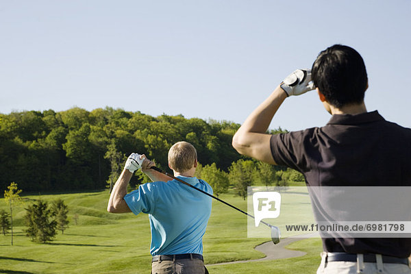 Men Playing Golf