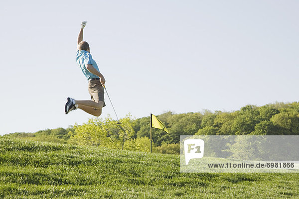 Begeisterung  springen  Golfspieler