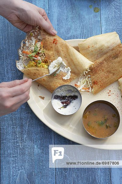 Dosa Filled With Curried Potato  Coconut Chutney  and Sambhar
