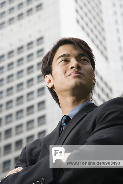 Businessman in front of High Rise Building