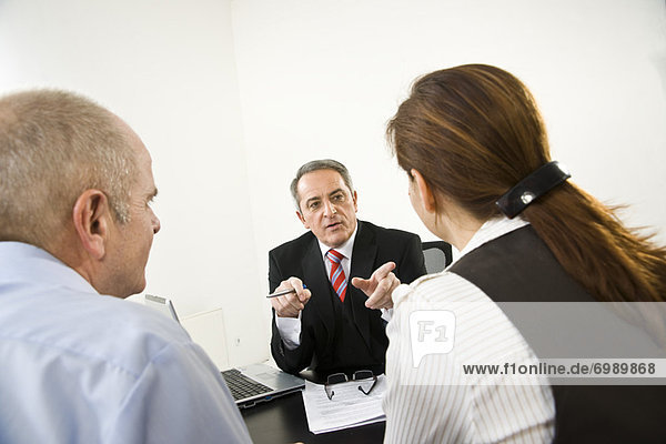 Businessman Talking to Employees
