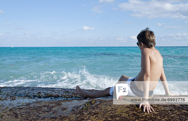 Boy Sitting by Surf  Playa del Carmen  Yucatan Peninsula  Mexico