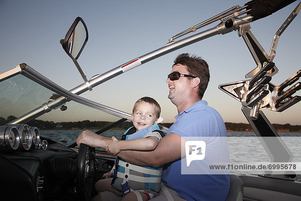 Father and Son in Speedboat