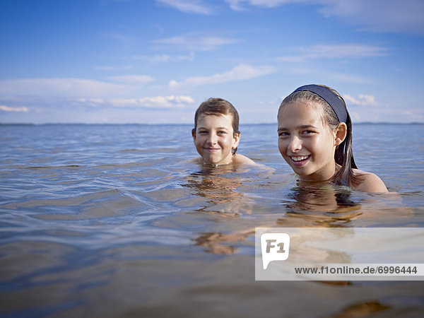 Boy and Girl Swimming  Lake Wanapitei  Sudbury  Ontario  Canada