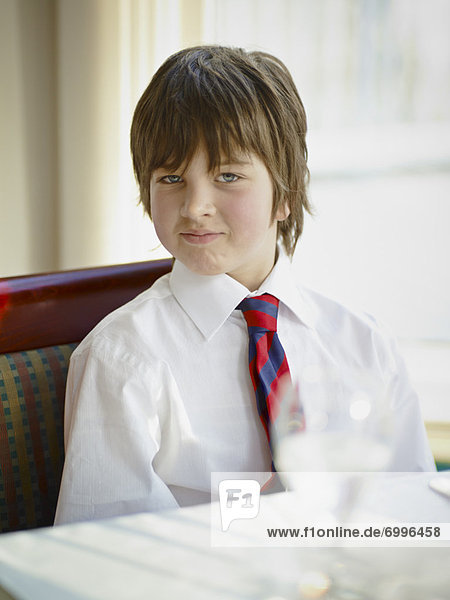 Boy wearing Shirt and Tie in Restaurant