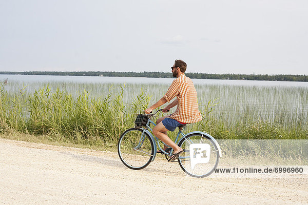 Man Riding Bike  Clearwater Lake Provincial Park  Manitoba  Canada