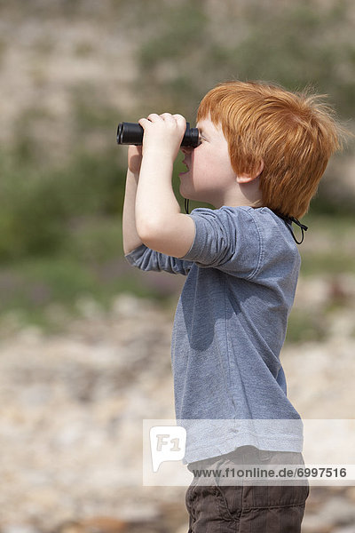 Boy Looking through Binoculars  Jasper National Park  Alberta  Canada