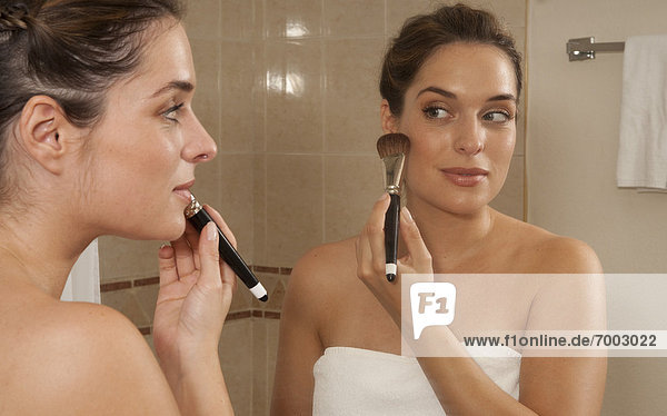 Woman Applying Make-up in Bathroom  Reef Playacar Resort and Spa  Playa del Carmen  Mexico