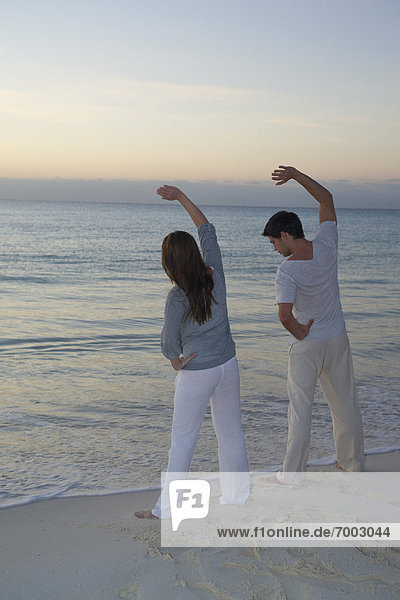 Couple Exercising on Beach  Reef Playacar Resort and Spa  Playa del Carmen  Mexico