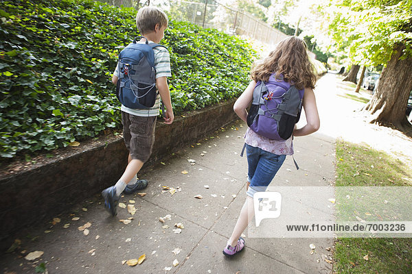 Boy and Girl Walking Home from School  Portland  Oregon