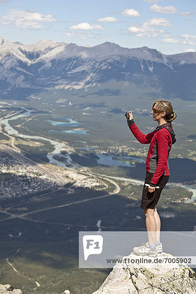 Woman taking Photo  Whistlers Mountain  Jasper National Park  Alberta  Canada
