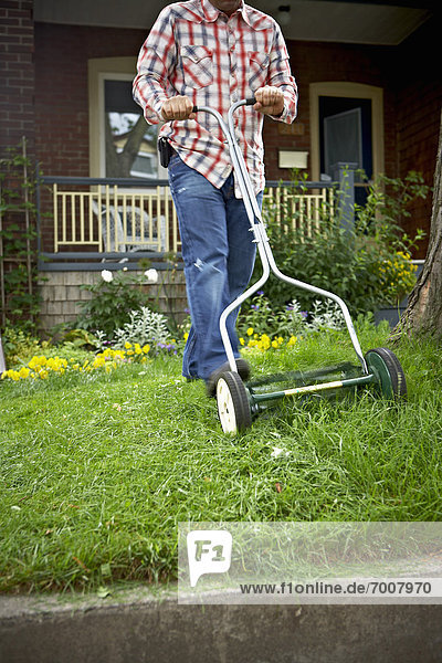 Man Cutting Grass  Toronto  Ontario  Canada