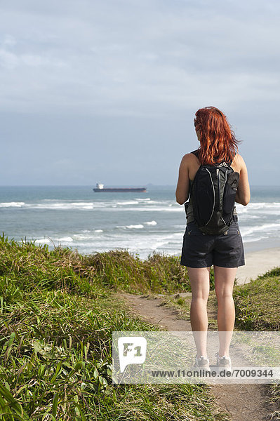 Backview of Woman Hiking and Looking at View  Ilha do Mel  Parana  Brazil