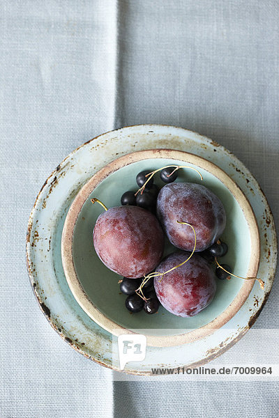 Plums and Black Currants in Bowl