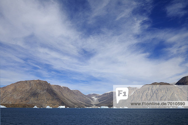 Iceberg and Bjorn Oer Mountain  Scoresbysund  Greenland