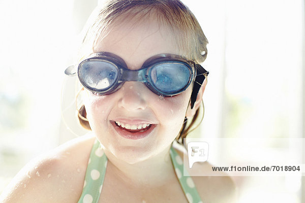 Smiling girl wearing goggles