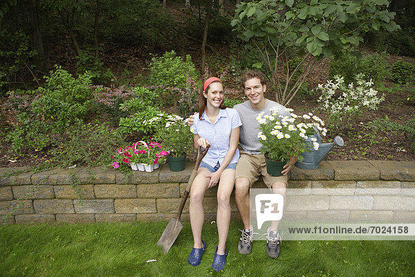 Young couple in garden (portrait)