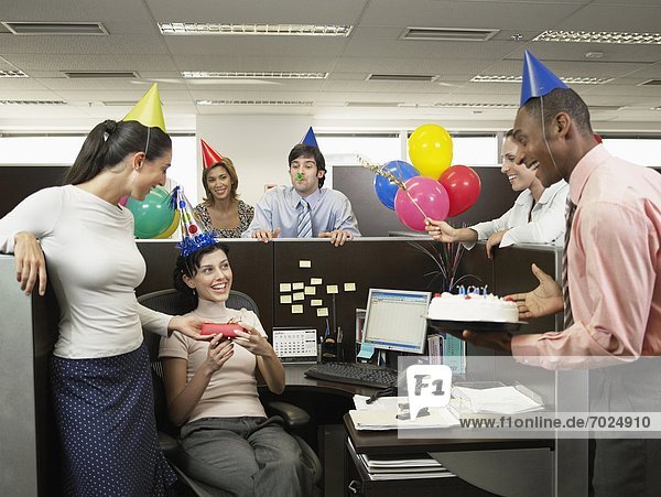 Office workers having birthday party