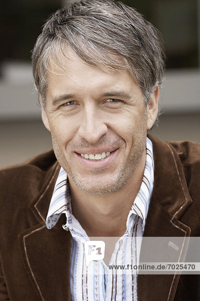 Mid adult man laughing (portrait)